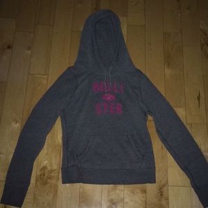 Gray hoodie with pink sewn on letters